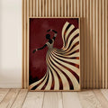 Female silhouette art framed on wood slat wall with striped flowing dress and burgundy tones