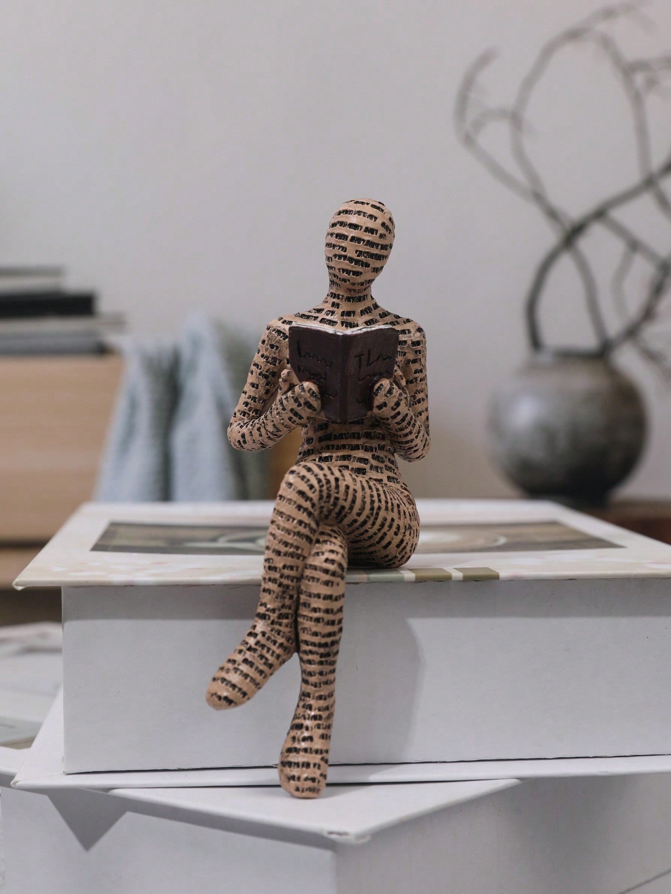 Discover the perfect addition to your home decor with our Abstract Sitting Figure Reading Book Resin Ornament. Crafted with intricate details, this abstract figure exudes a sense of relaxation and intellectual sophistication. Made with premium resin material, it adds a touch of elegance to any room and serves as a reminder to indulge in the pleasure of reading.
