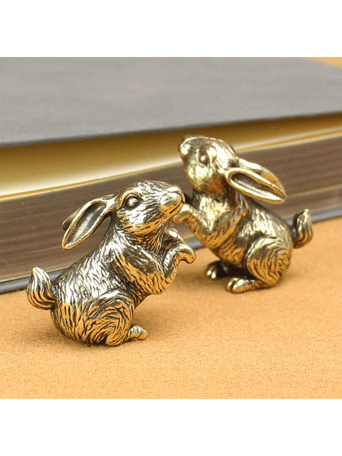 This adorable brass bunny ornament adds a whimsical touch to your home decor. Made from high-quality brass, it is a durable and charming addition to any room. Its intricate design and expert craftsmanship make it a unique and delightful accent piece. Create a playful atmosphere with this charming bunny ornament.