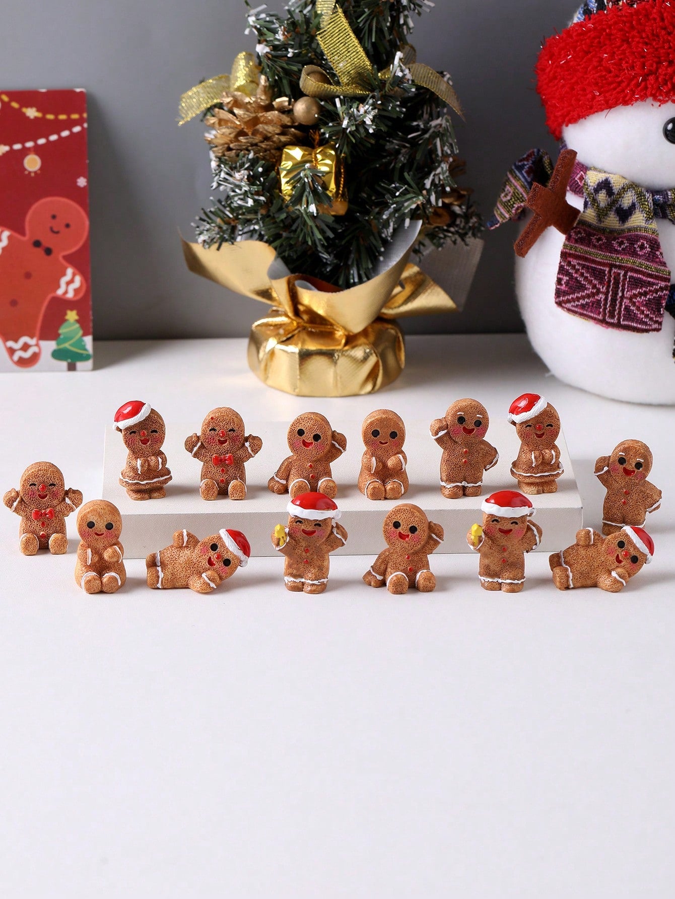 Bring festive charm to your holiday displays with these delightful mini gingerbread figurines. Crafted from durable resin, each statue captures the whimsical character of classic gingerbread designs, making them ideal for seasonal decorating, creative craft projects, and thoughtful gift-giving. Their compact size allows for versatile placement on shelves, mantels, desks, or windowsills, while their detailed craftsmanship adds authentic holiday warmth to any space. Whether you're building a festive village s