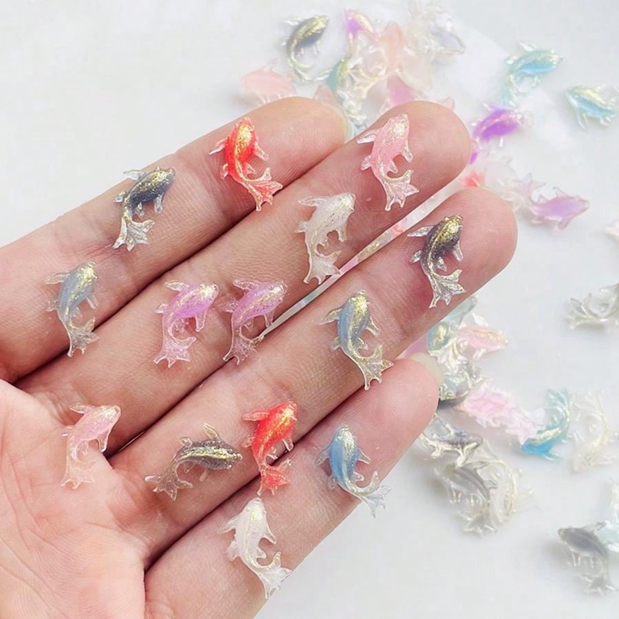Add a touch of cuteness to your crafts and jewelry with our Adorable Mini Shiny Goldfish Resin Figurines! With 100 pieces per pack, you'll have plenty to work with. Made from high-quality resin, these figurines are perfect for adding a unique and eye-catching element to your creative projects.
