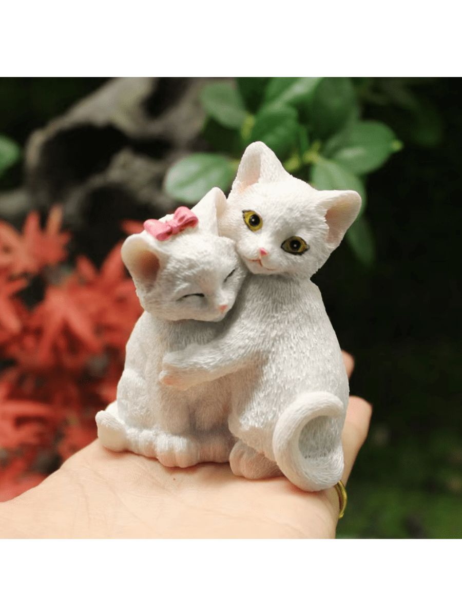 Display your love for feline friends with our Adorable Resin Hugging Cats Figurine. This charming desktop décor is perfect for cat lovers, adding a touch of cuteness to any space. Crafted from high-quality resin, these hugging cats are a delightful addition to your home.