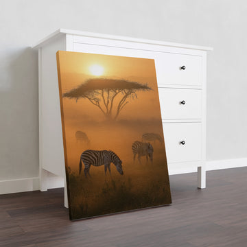 Add a touch of nature and adventure to your home with our African Safari Canvas Wall Art. Featuring a stunning photograph of zebras at sunset, this artwork is sure to be a statement piece in any living room, sofa backdrop, or bedside decoration. Bring the beauty of wildlife into your home with this high-quality print.