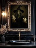 Ornate gold framed witch holding toilet paper above dark bathroom vanity