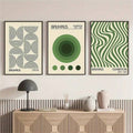 Green and cream Bauhaus geometric triptych above a modern sideboard