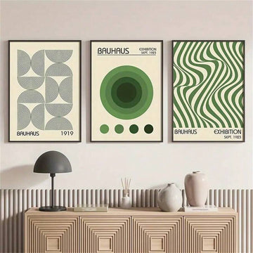Green and cream Bauhaus geometric triptych above a modern sideboard