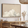 Beige cloud wall art in warm wood frame above sideboard with neutral boho styling