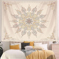 Beige paisley mandala tapestry displayed above bed in neutral bedroom