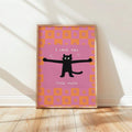 Black cat love canvas poster in a light wood frame on a sunlit wall