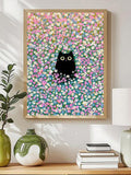 Framed black cat floral wall art above console table with vases and books