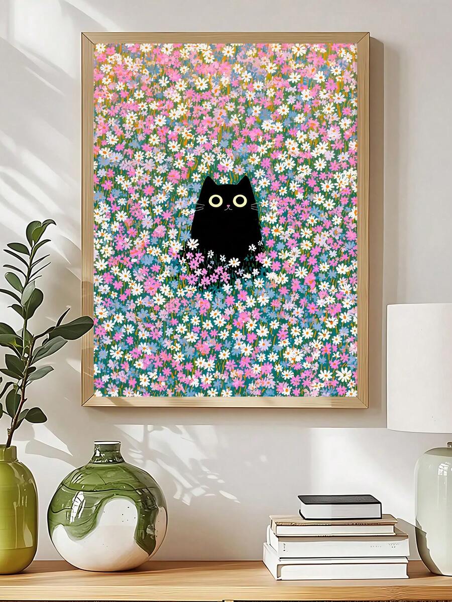 Framed black cat floral wall art above console table with vases and books