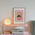 Black cat sardines tin poster on pink shelf