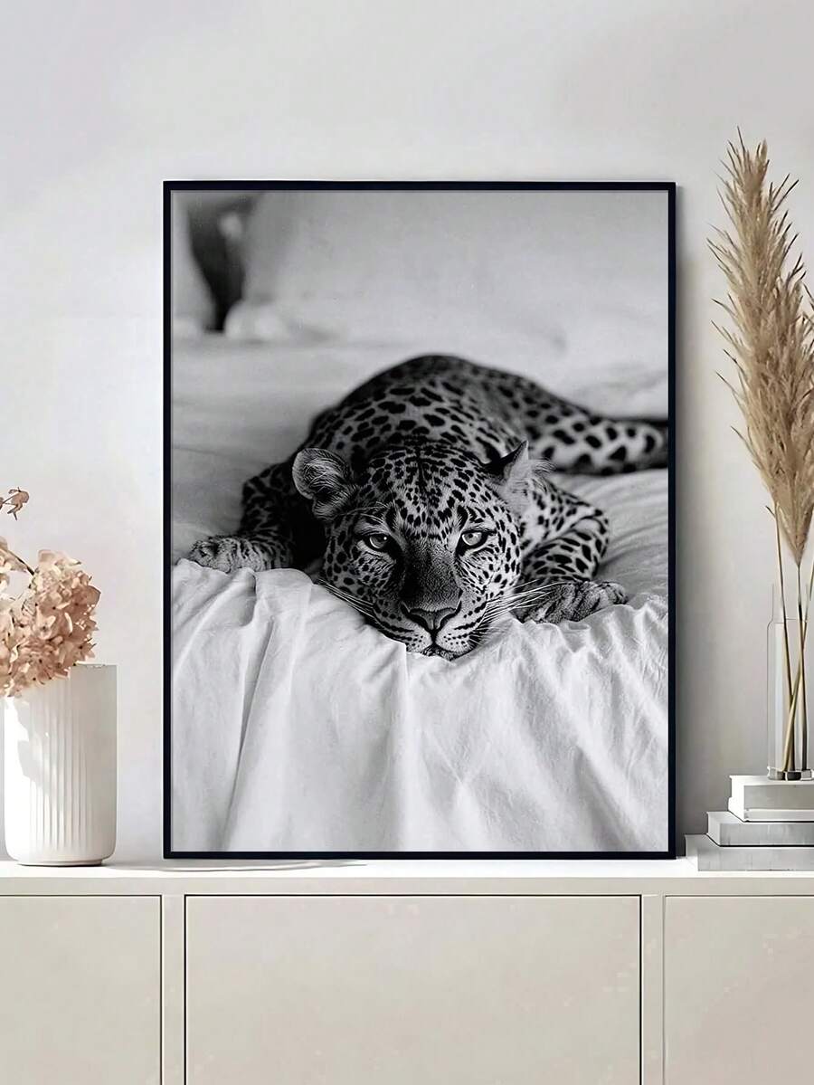 Add a bold animal inspired accent to your home with this Black and White Leopard on the Bed Canvas Poster. Featuring a striking leopard subject in a monochrome aesthetic, this artwork brings a mix of wild character and modern style to your walls