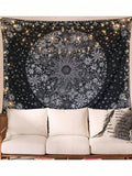 Black and white mandala tapestry displayed above sofa with string lights