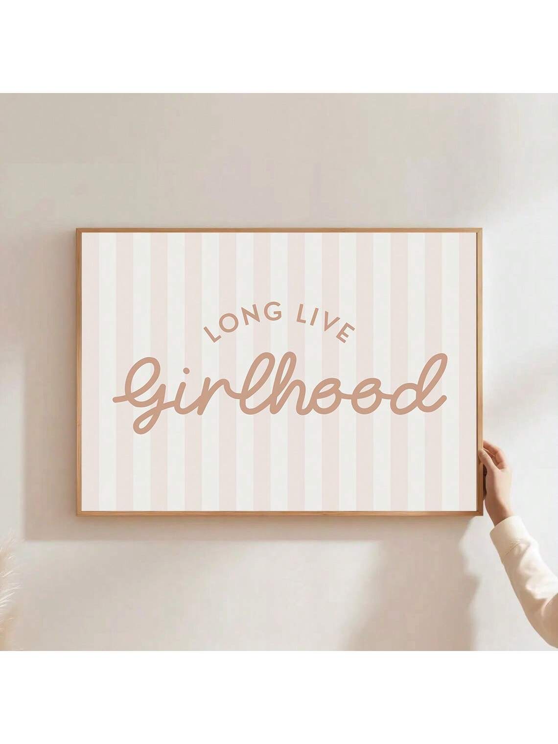 Celebrate the innocence and joy of childhood with this Blush Pink Striped Long Live Girlhood Wall Art. Designed with a minimalist aesthetic, it adds a soft, elegant touch to any baby girl’s nursery. The gentle blush stripes complement the inspiring quote, creating a serene and uplifting atmosphere that nurtures imagination and growth. Perfect for parents seeking tasteful, meaningful decor that blends style with sentiment.