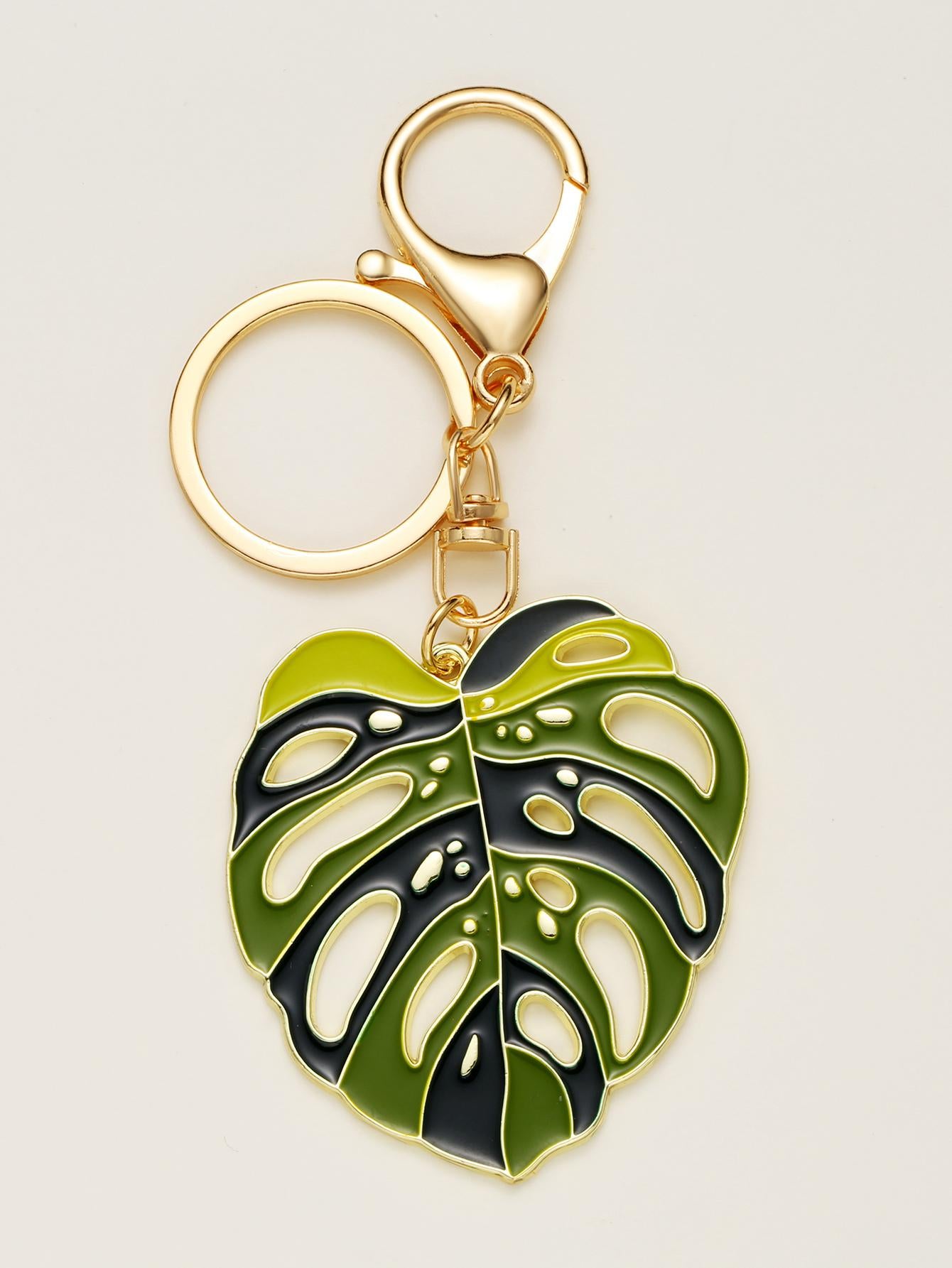 Introducing our Bohemian Tropical Leaf Charm Keychain, the perfect accessory for nature lovers. Made with a tropical leaf design, this keychain adds a chic touch to your everyday routine. Keep your keys organized and show off your love for nature with this unique keychain.