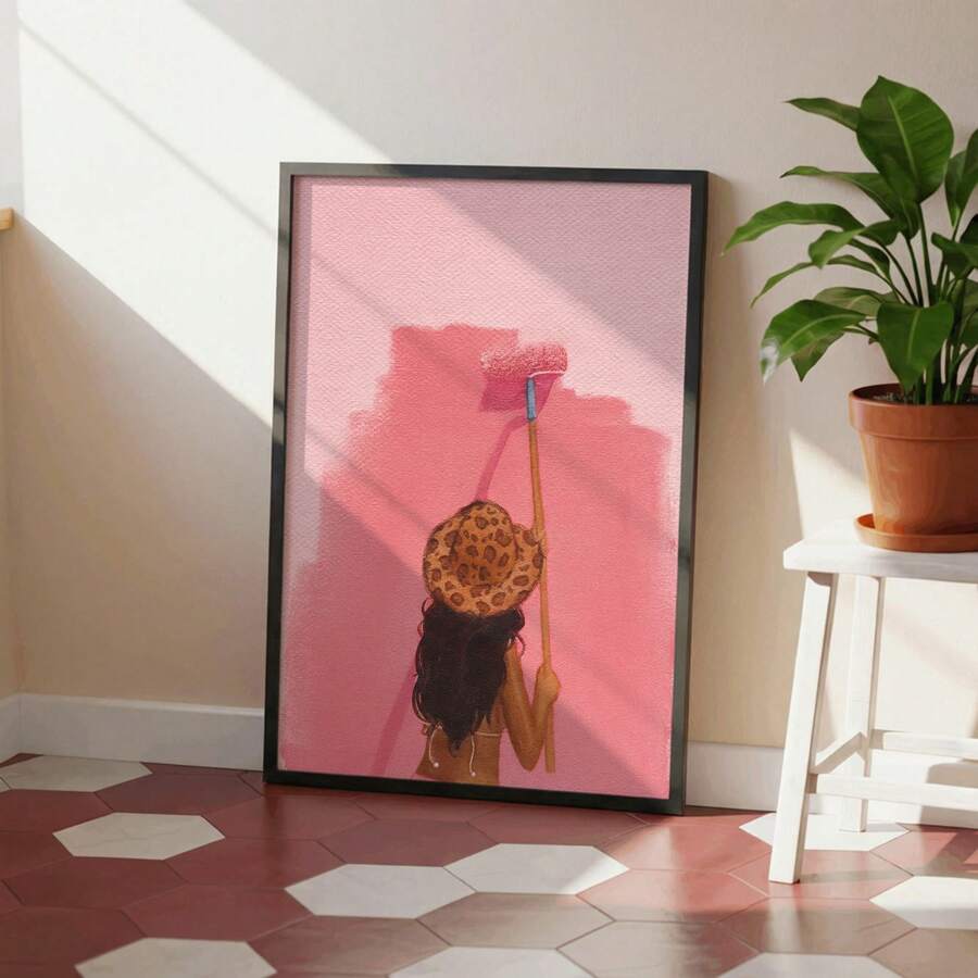 Pink woman painting wall art in black frame