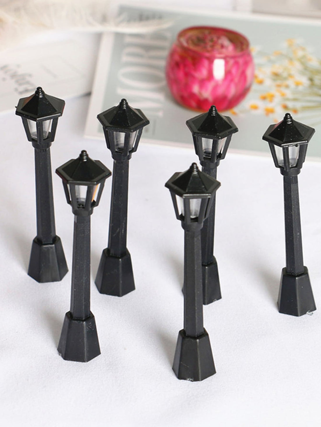Elevate your home decor with our Charming 6-Piece Street Light Design Decor Set. Enjoy the whimsy of these intricate, detailed accents in any room. Crafted with expert precision and design, this set adds a touch of charm to any space. Enhance your home with our one-of-a-kind decor.