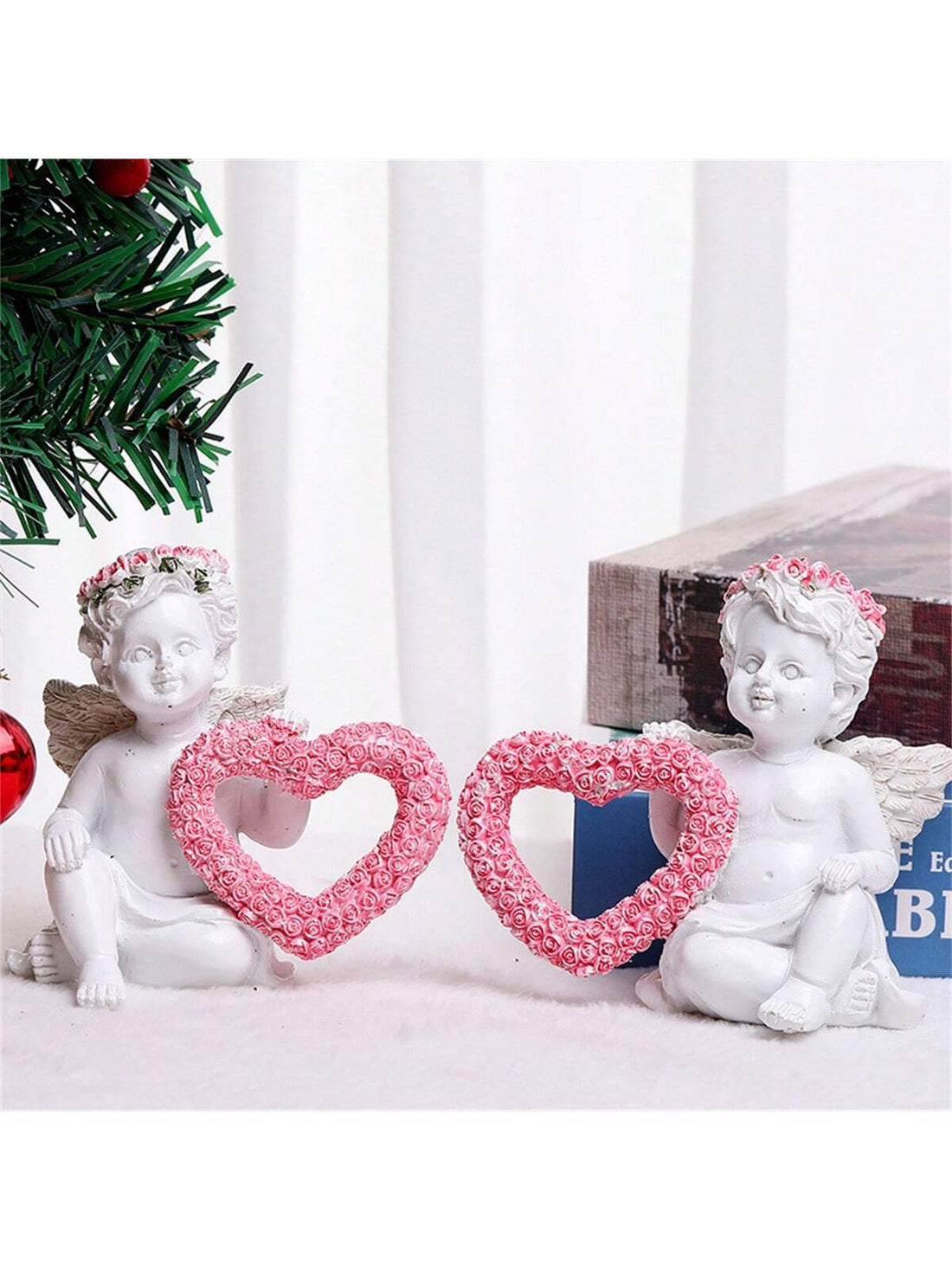 Add a touch of charm to your desk with our Charming Angel &amp; Rose Heart-Shaped Resin Statues. These beautiful ornaments are perfect for Valentine’s Day or festive decor. Made of high-quality resin, these statues are durable and will add an elegant touch to any setting.