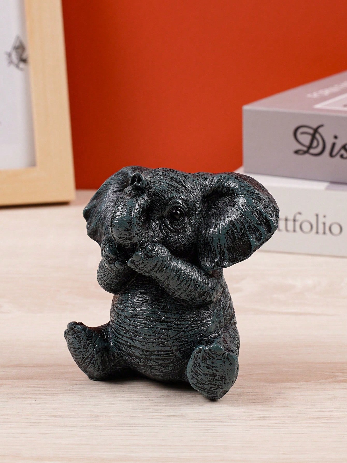 This charming black elephant resin decor is the perfect addition to any office, home, or garden. With its elegant design and versatile use, it adds a touch of sophistication to any space. Made from high-quality resin, it is durable and long-lasting. Elevate your decor with this charming piece today!