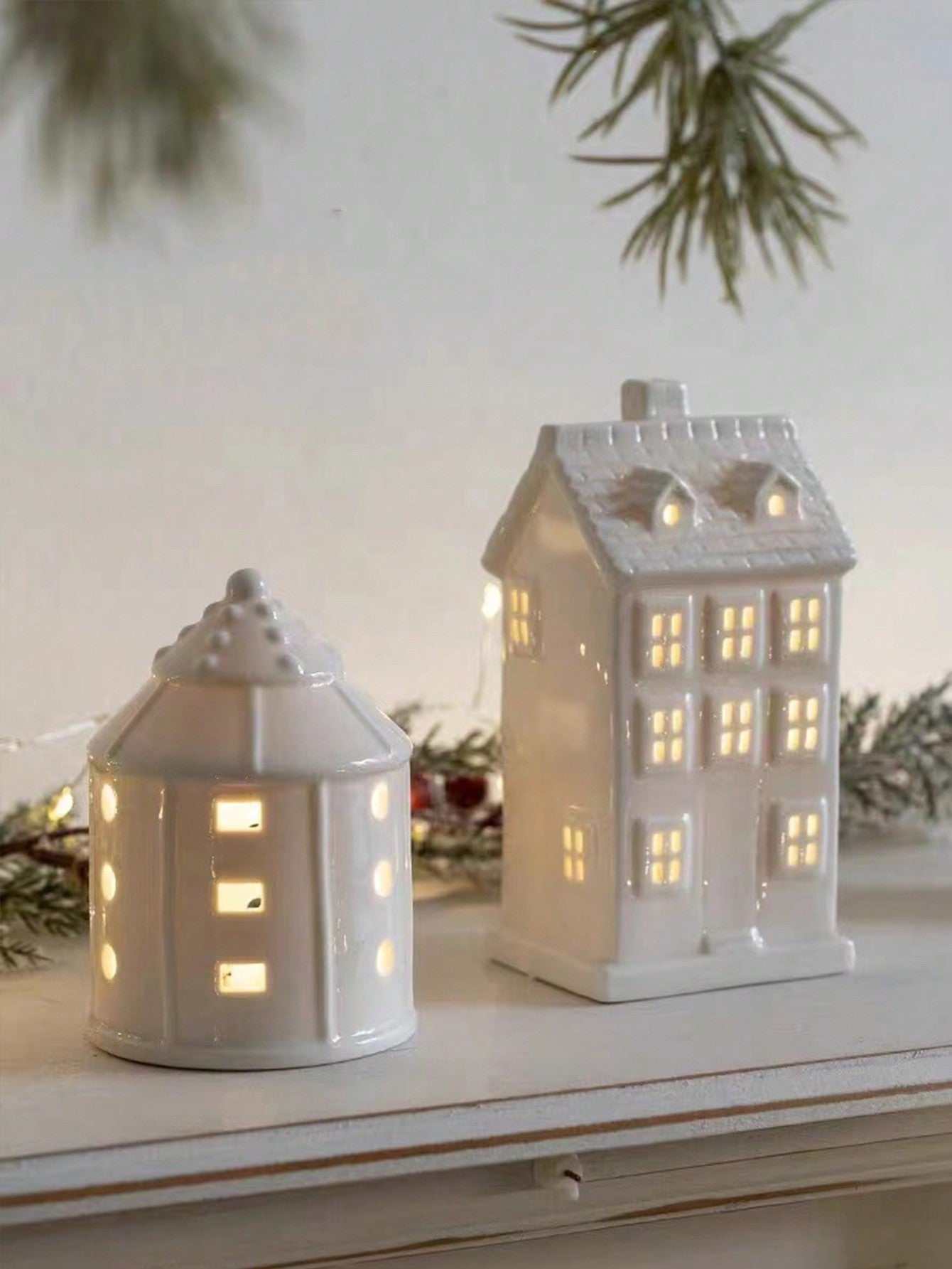 Introduce festive charm into your home with our Charming Ceramic Christmas House Ornament. Made from high-quality ceramic, this ornament adds a cozy atmosphere to your holiday decor. With its intricate details and warm colors, it's the perfect addition to any Christmas display.