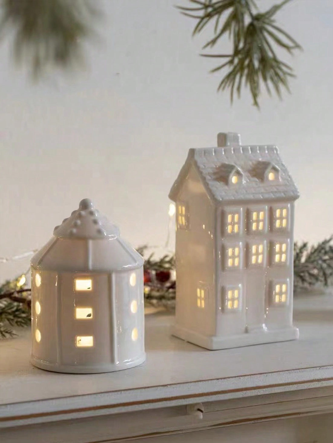 Introduce festive charm into your home with our Charming Ceramic Christmas House Ornament. Made from high-quality ceramic, this ornament adds a cozy atmosphere to your holiday decor. With its intricate details and warm colors, it's the perfect addition to any Christmas display.