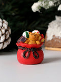 This delightful snowman figurine brings timeless holiday charm to any space. Crafted with meticulous attention to detail, it features a cheerful snowman paired with a coordinating gift bag, making it an ideal accent for seasonal displays. Perfect for tabletops, shelves, or miniature landscape arrangements, this festive ornament captures the warmth and nostalgia of winter celebrations. Its compact size and versatile design complement both traditional and contemporary décor styles, while the included gift bag