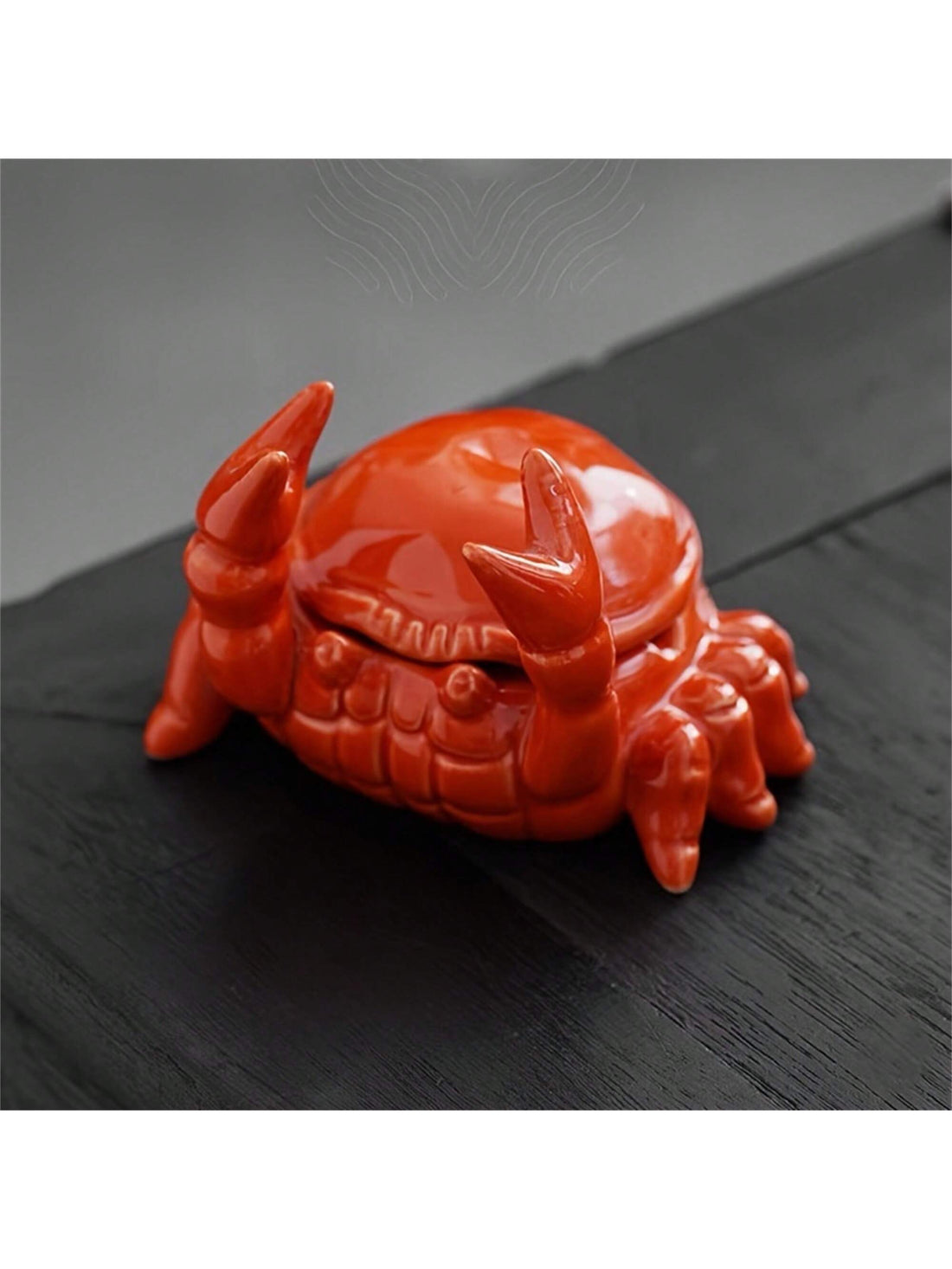 Enhance your desk decor with our Charming Crab Ceramic Ashtray with Lid - perfect for both home and office use. This adorable Chinese-style ashtray features a lid to contain odors and keep your space smelling fresh. Made with high-quality ceramic, this ashtray is not only charming but also durable for long-term use.