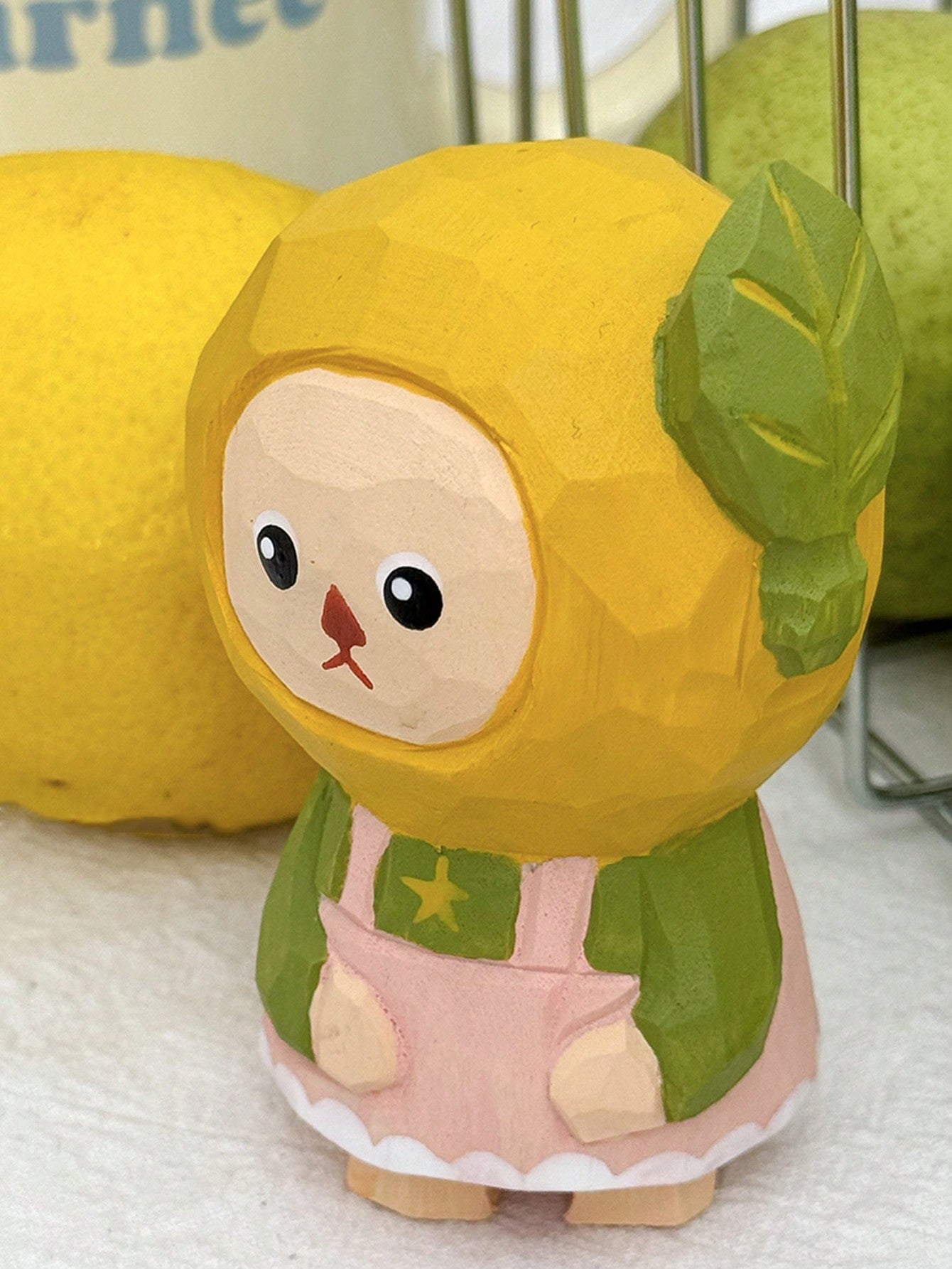 This charming handmade wooden lemon sculpture is the perfect whimsical addition to any desktop, making it a delightful home decor piece or unique gift. Crafted with expert precision, the intricate details and vibrant colors bring this lemon to life, adding a touch of playfulness to any space.