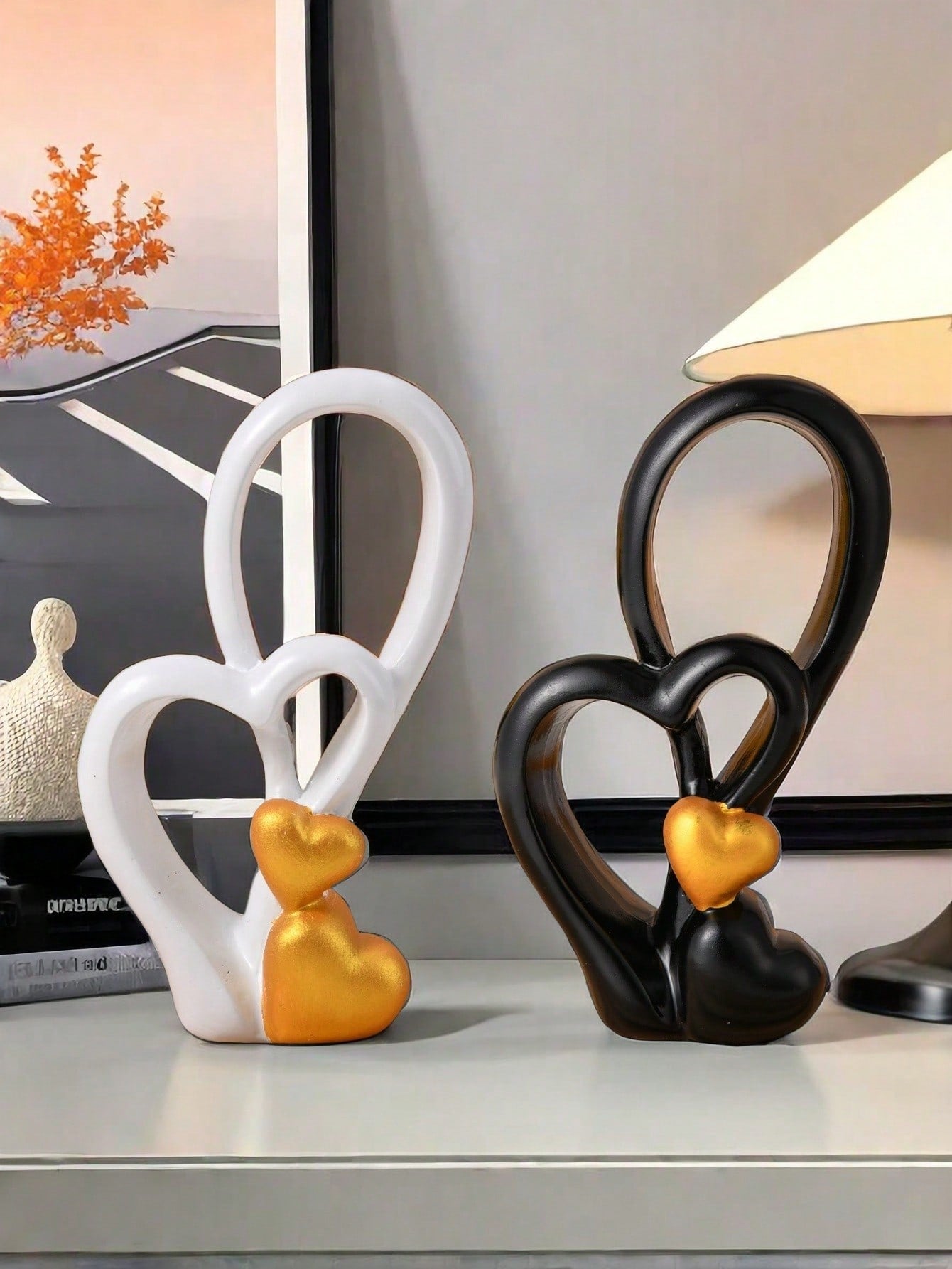 This charming heart-shaped resin ornament adds a touch of elegance to any home décor. Perfect for weddings, Valentine's Day, and showcase displays. Handcrafted with intricate detail, this ornament is a must-have for any occasion. Show your love and adoration with this stunning piece