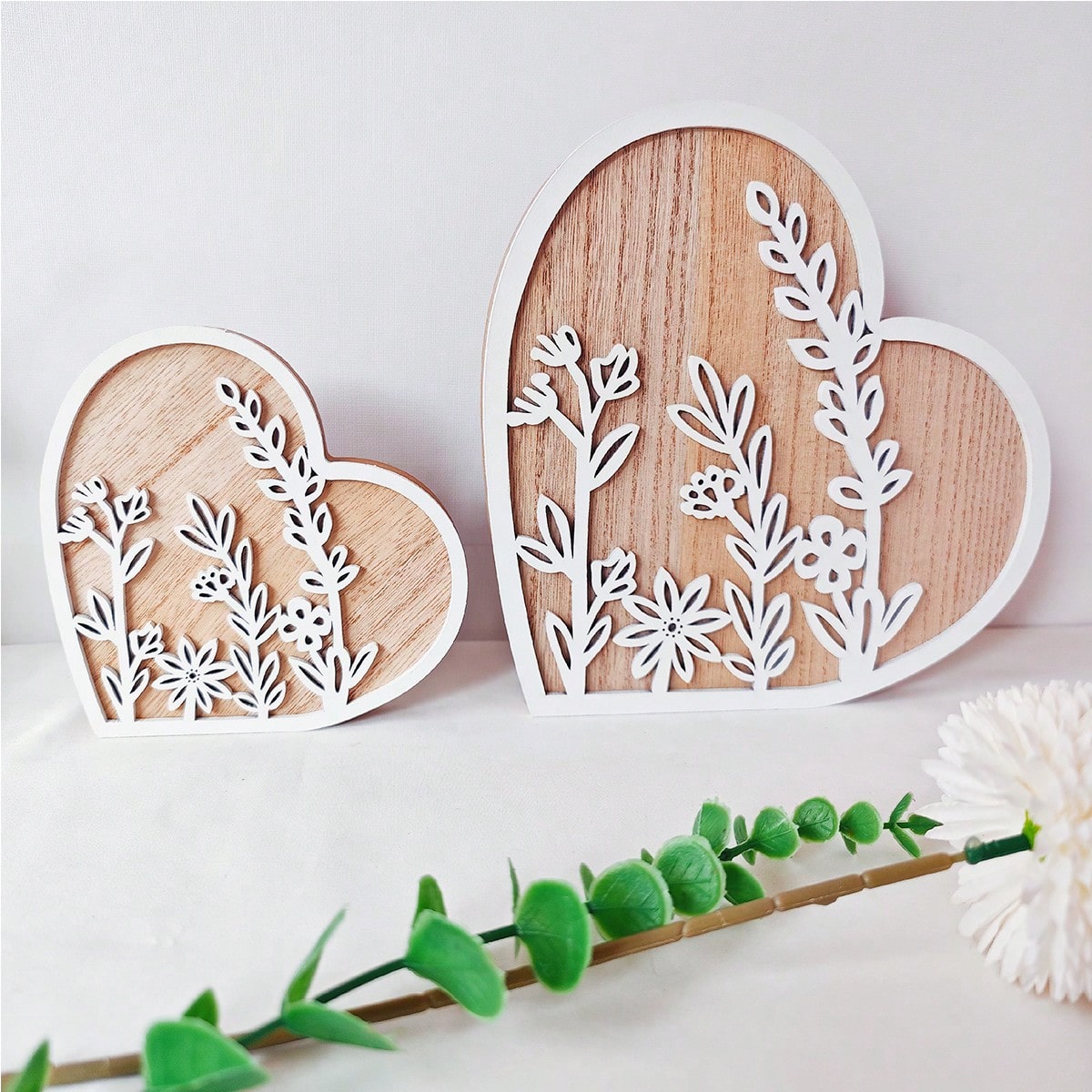 This charming wooden ornament, shaped like a heart, is the perfect addition to your Valentine's Day decorations and romantic home decor. Expertly crafted, it exudes elegance and warmth, making it a great gift or centerpiece for your special day. Add a touch of love to your home with this beautiful ornament.