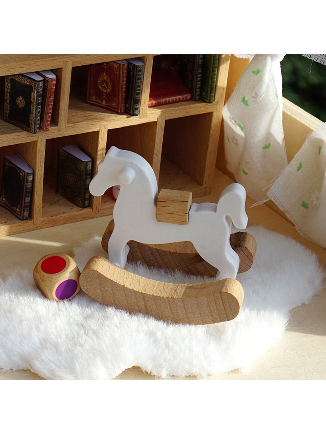 Enhance your dollhouse with this charming wooden horse. Perfect for 1:12 scale dollhouses, this miniature horse adds a touch of detail and realism to your decor. Expertly crafted with precise proportions, this wooden accent piece is a must-have for any dollhouse enthusiast.