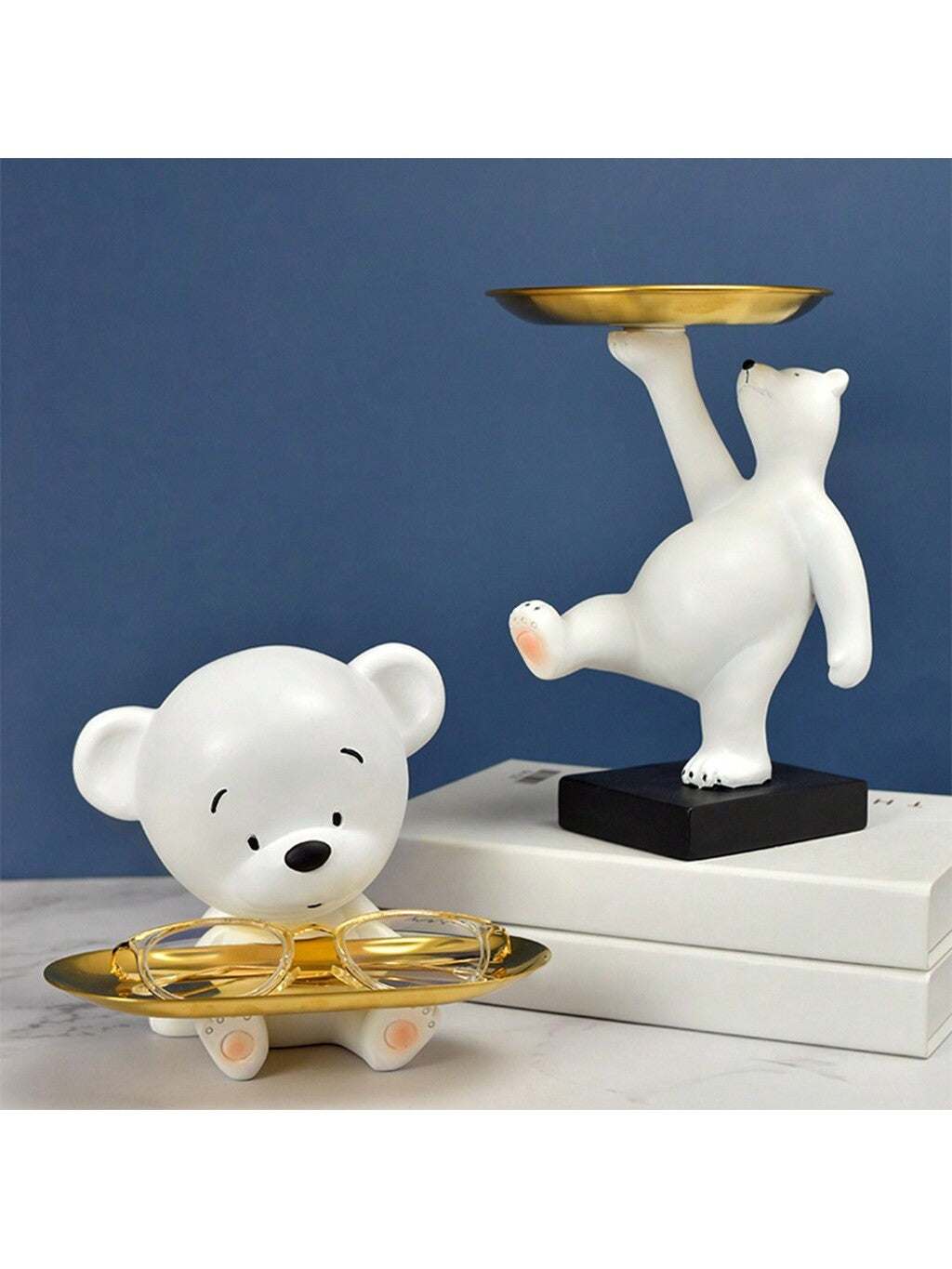 This Charming Nordic White Bear Figurine serves as a dual purpose 2-in-1 jewelry tray and key holder, adding elegance to any home decor. Made from high-quality material, this unique piece seamlessly combines function and style, making it a perfect addition to any space.
