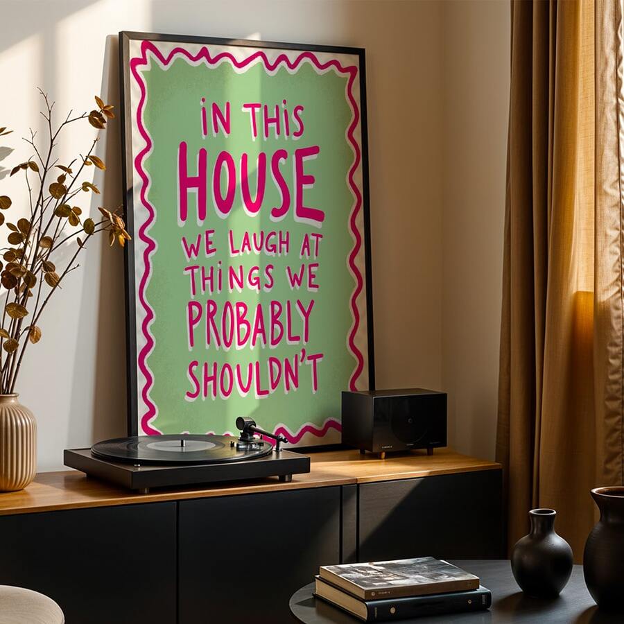 Bring warmth and laughter into your home with this charming pink and green quote wall art. Featuring the uplifting message "We Laugh in This Home," this retro-inspired canvas decoration adds personality and joy to any living space. The modern graphic design works beautifully in home offices, bedrooms, or living rooms, creating an inviting atmosphere that celebrates life's lighter moments. Available as both framed and unframed options, this waterproof canvas piece is durable and easy to display. Perfect for 