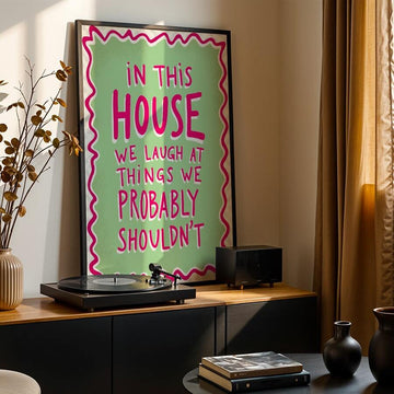 Bring warmth and laughter into your home with this charming pink and green quote wall art. Featuring the uplifting message "We Laugh in This Home," this retro-inspired canvas decoration adds personality and joy to any living space. The modern graphic design works beautifully in home offices, bedrooms, or living rooms, creating an inviting atmosphere that celebrates life's lighter moments. Available as both framed and unframed options, this waterproof canvas piece is durable and easy to display. Perfect for 