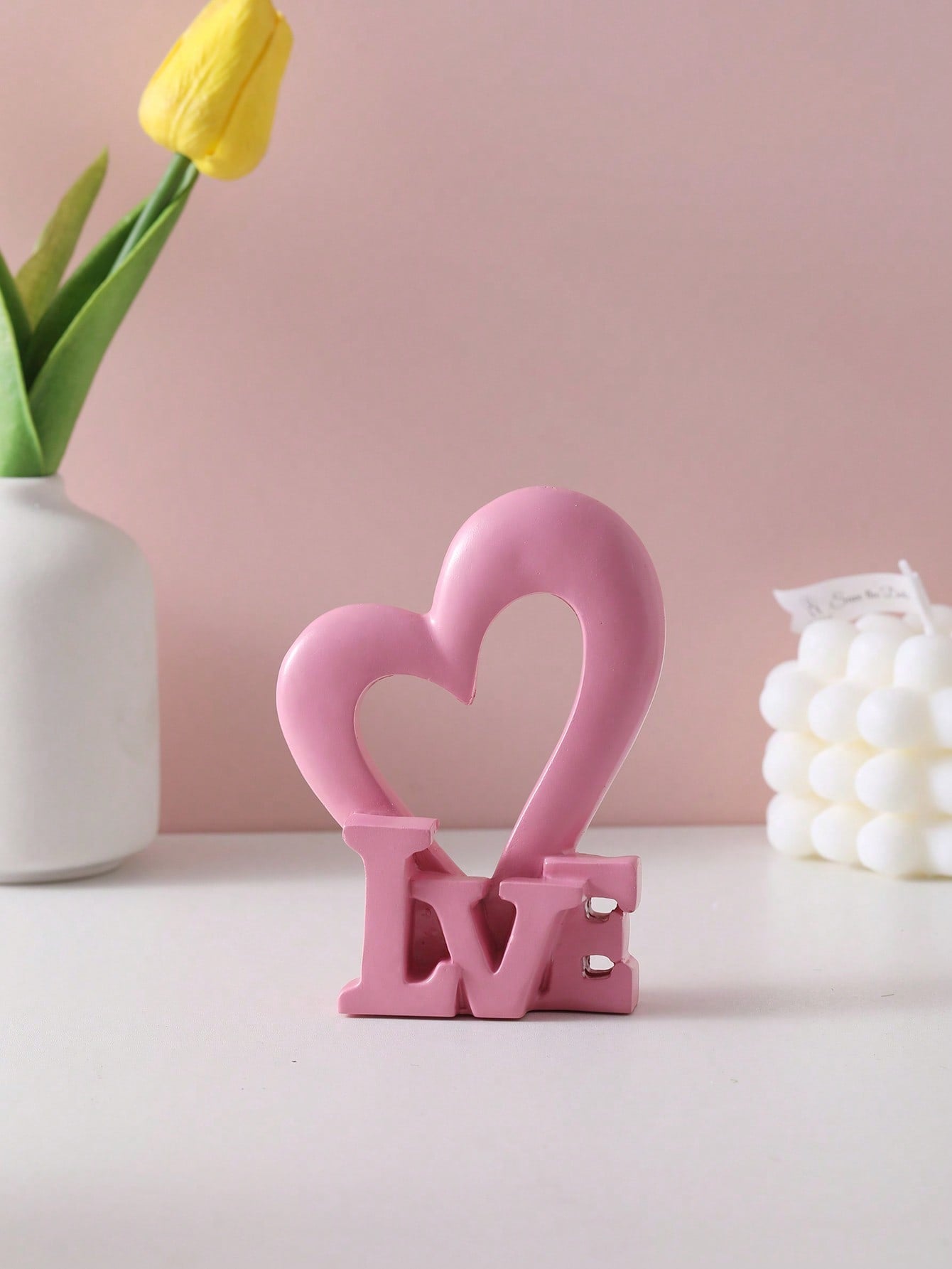 Add a touch of love to your home decor with our Charming Resin LOVE Statue. This stunning piece is perfect for any space and special occasion. Made of high-quality resin, it is durable and will add a beautiful decorative element to your home. Share the love with this elegant statue.