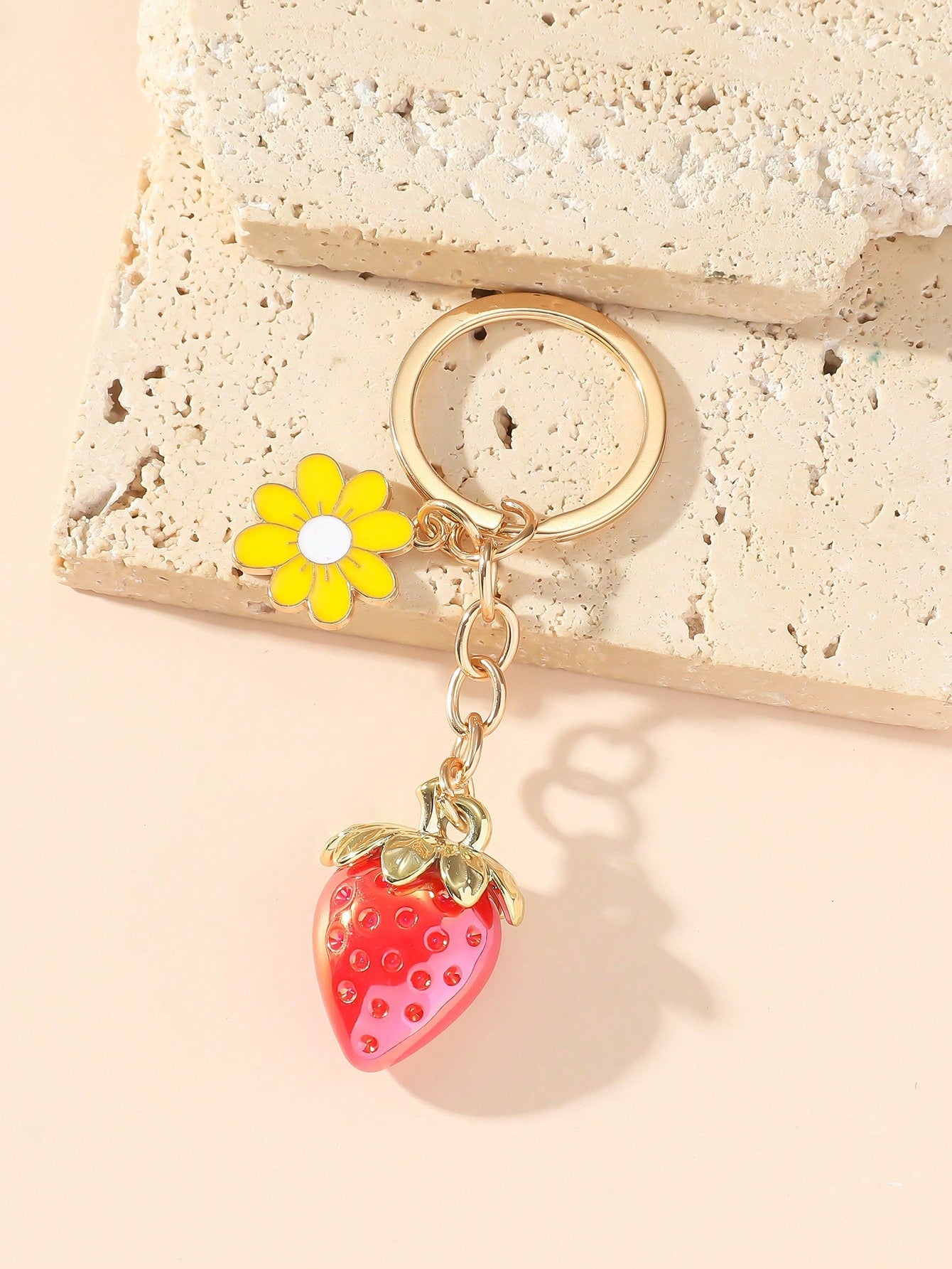 Introducing the Charming Strawberry Flower Keychain - a cute, transparent fruit style accessory for her. Made with high-quality materials, this keychain will add a touch of charm to any purse or set of keys. Perfect as a gift for the special someone in your life.