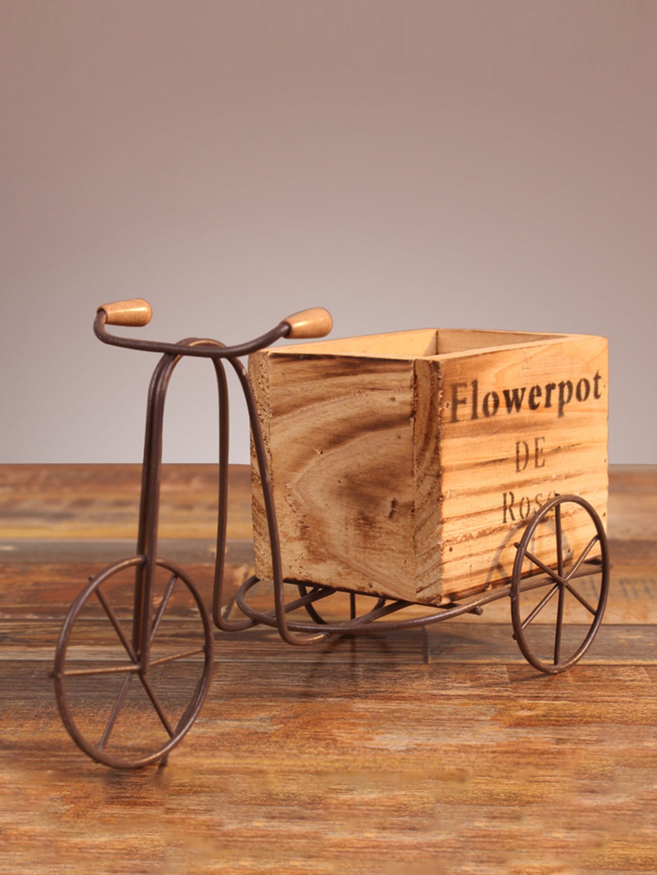 This charming wooden bicycle flower pot stand is the perfect decorative addition to any home or garden. Crafted with excellent craftsmanship, it adds a touch of whimsy and style to your space. Its sturdy design allows for multiple pots to be displayed, making it both functional and beautiful.