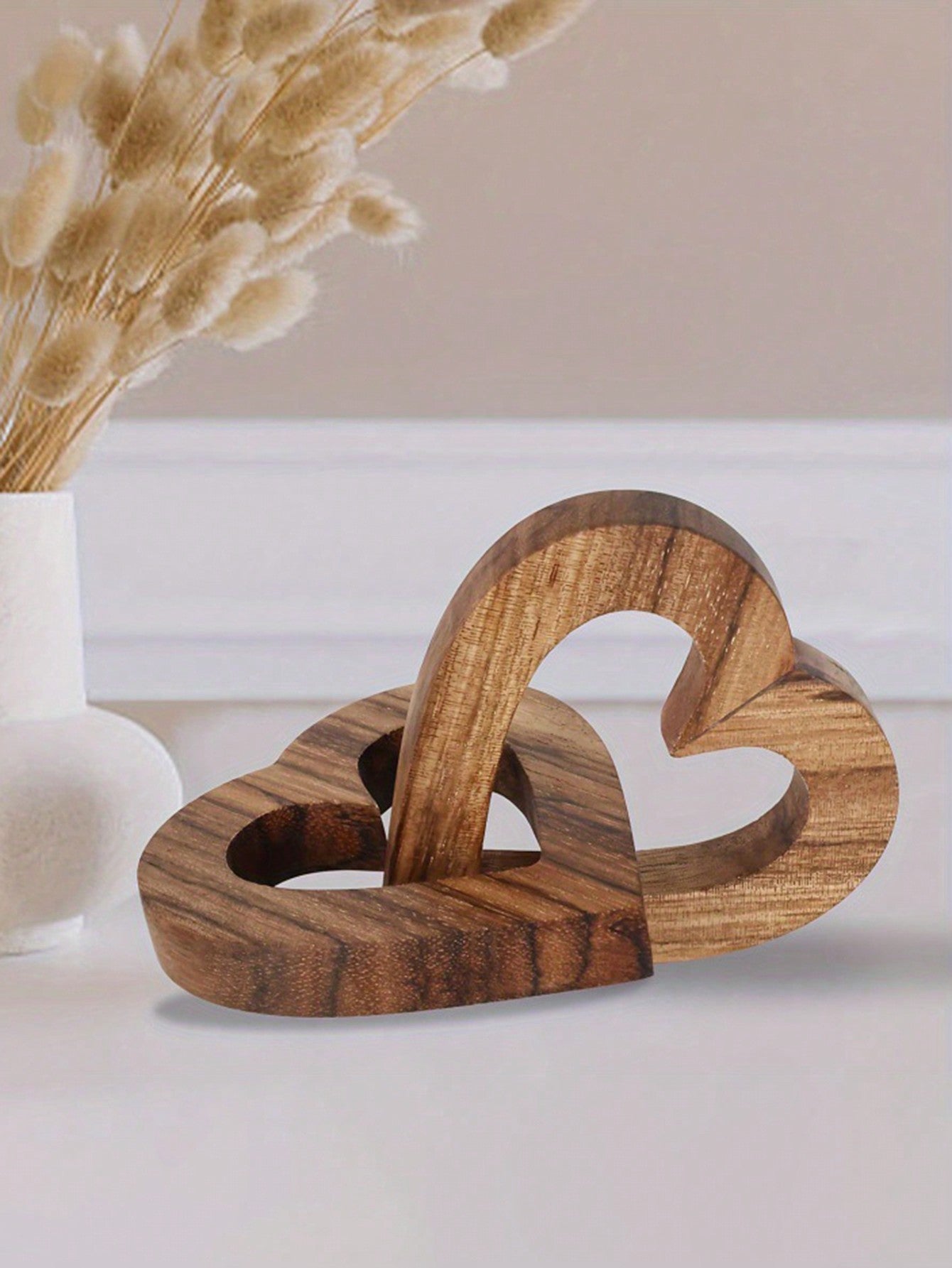 This charming wooden double heart chain decor is the perfect Valentine's Day gift for couples, friends, and family. It adds a touch of warmth and love to any home decor with its unique design and durable wooden construction. Show your loved ones how much they mean to you with this special gift.