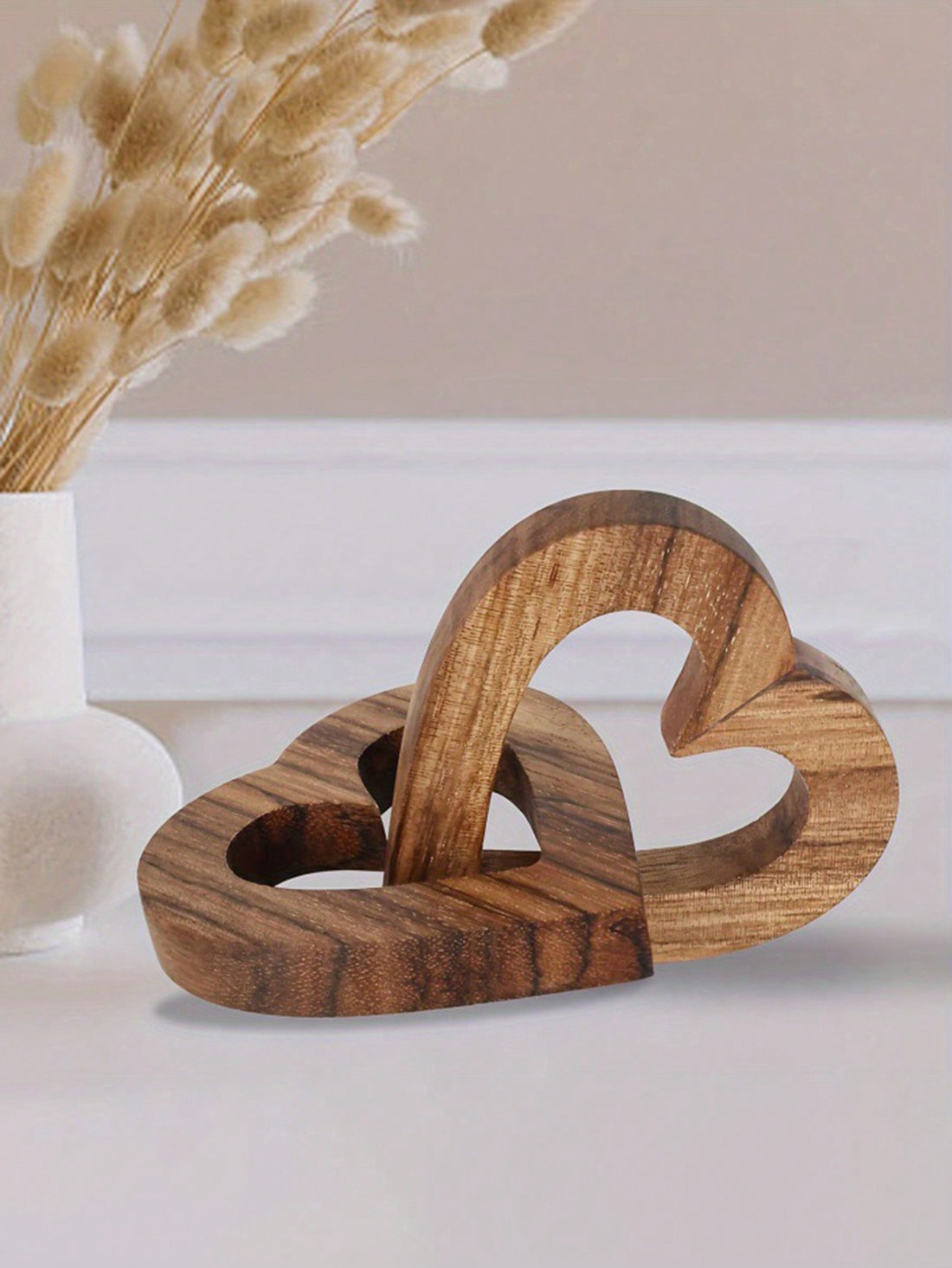 This charming wooden double heart chain decor is the perfect Valentine's Day gift for couples, friends, and family. It adds a touch of warmth and love to any home decor with its unique design and durable wooden construction. Show your loved ones how much they mean to you with this special gift.