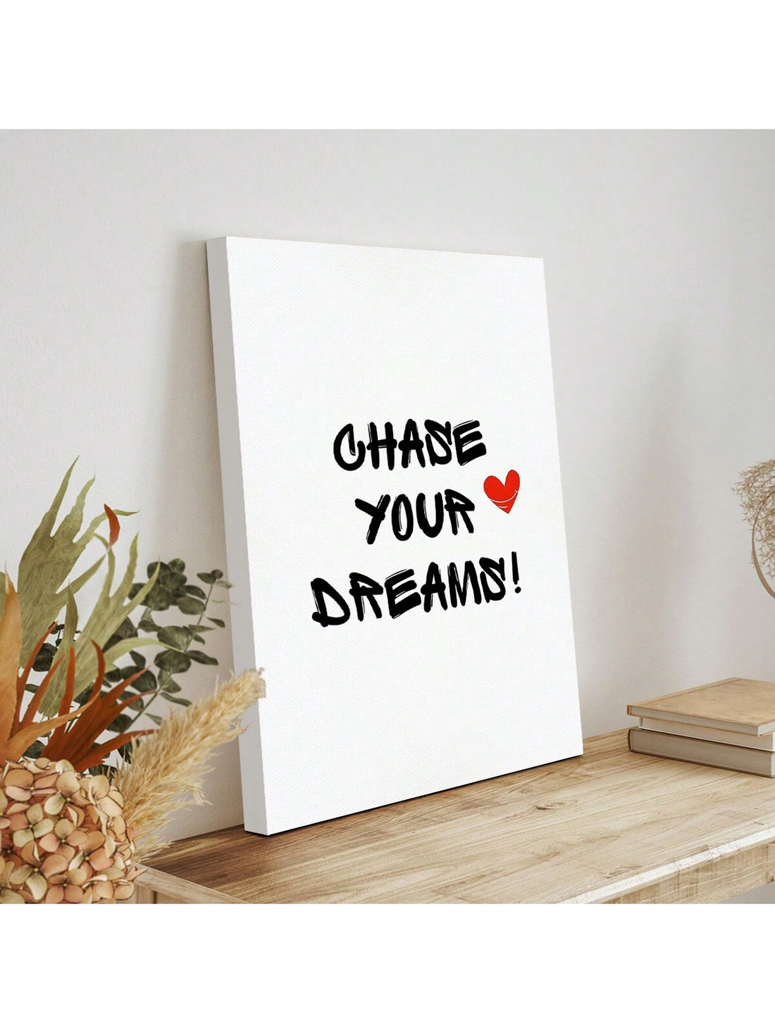 Add a touch of inspiration to your space with our "Chase Your Dreams" canvas wall art. Perfect for both home and office decor, this piece combines beautiful design with motivational messaging to help you stay focused on your goals. Let this canvas remind you to never give up on your dreams.