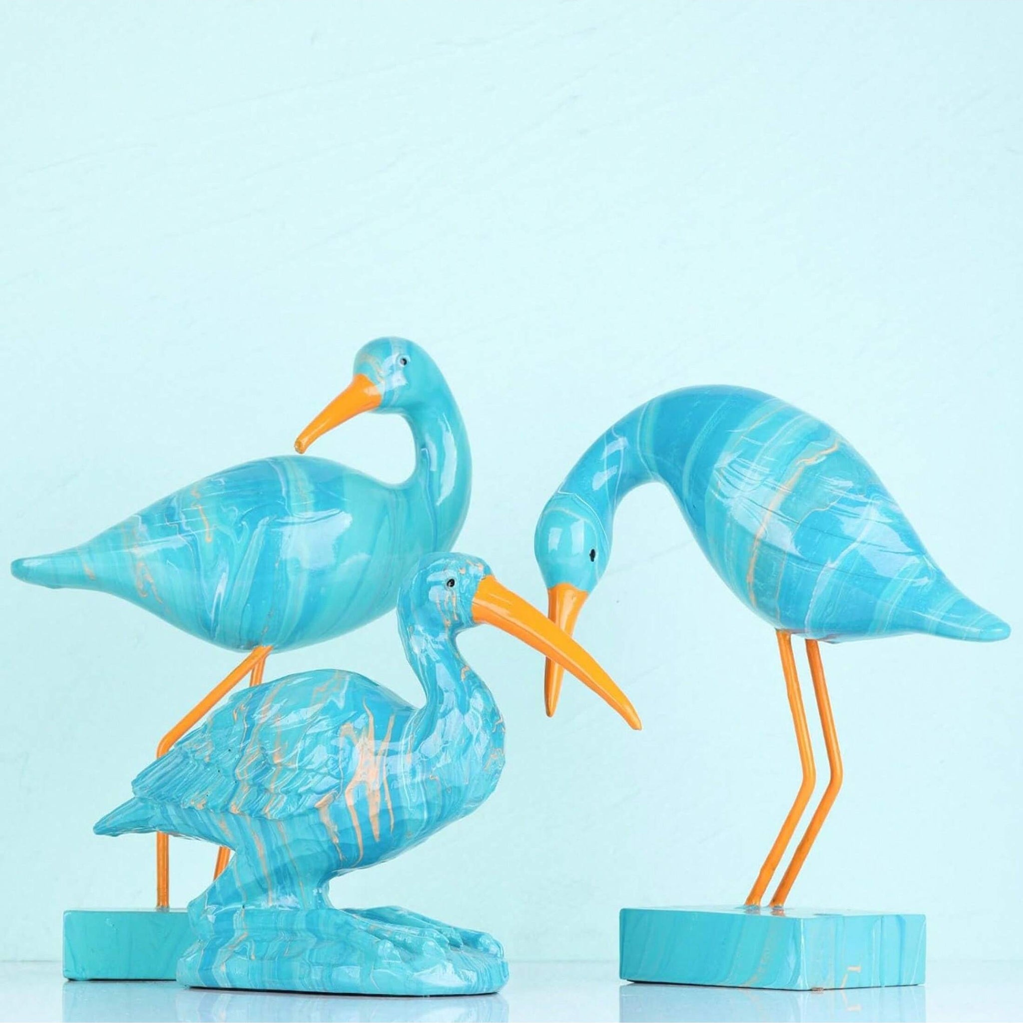 Elevate your living space with our Chic Blue Flamingo Figurine. Crafted from stylish resin, this unique home décor accent adds a touch of sophistication to your office, bookshelf, or desk. Featuring a sleek design and vibrant color, it's the perfect addition to any modern space.