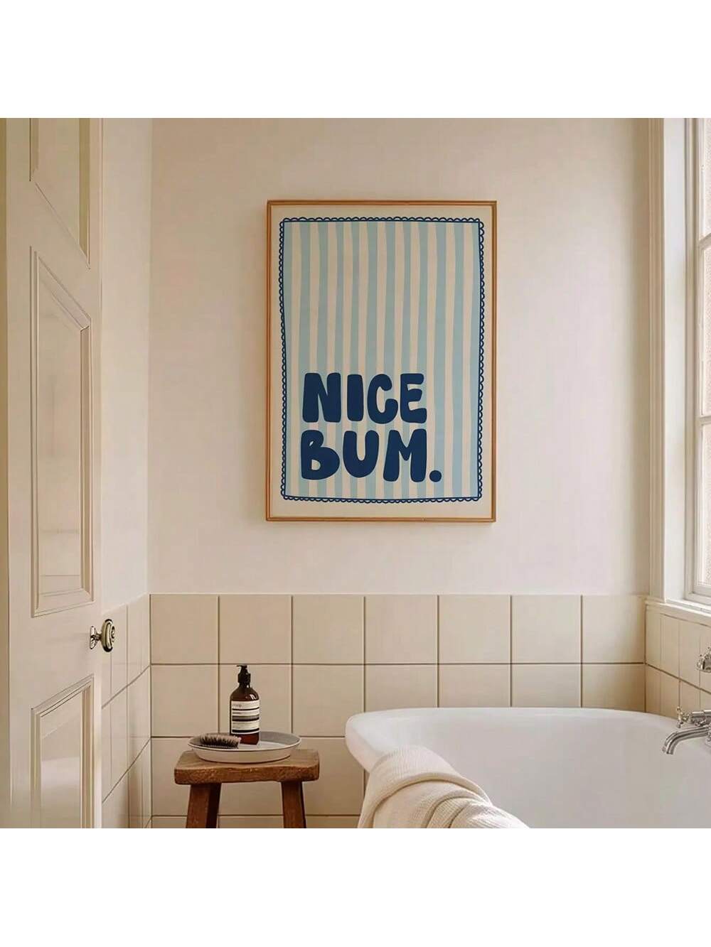 Add a playful touch to your bathroom with this Chic Blue Stripe 'Nice Bum' poster. Featuring minimalist design and clean lines, this canvas wall art blends humor with modern decor seamlessly. Its subtle blue stripes enhance any space while delivering a witty compliment that lightens the mood. Durable and stylish, it’s an expert choice for refreshing your bathroom ambiance with contemporary charm.