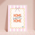 Transform your living space with this charming Home Sweet Home wall art. Featuring a delicate pink striped bow design, this canvas print combines modern aesthetics with cozy warmth. The graphic lettering style adds personality to any room, while the waterproof canvas ensures lasting beauty. Perfect for your dining room, bedroom, or living area, this framed hanging painting brings a touch of elegance and comfort to your home decor.