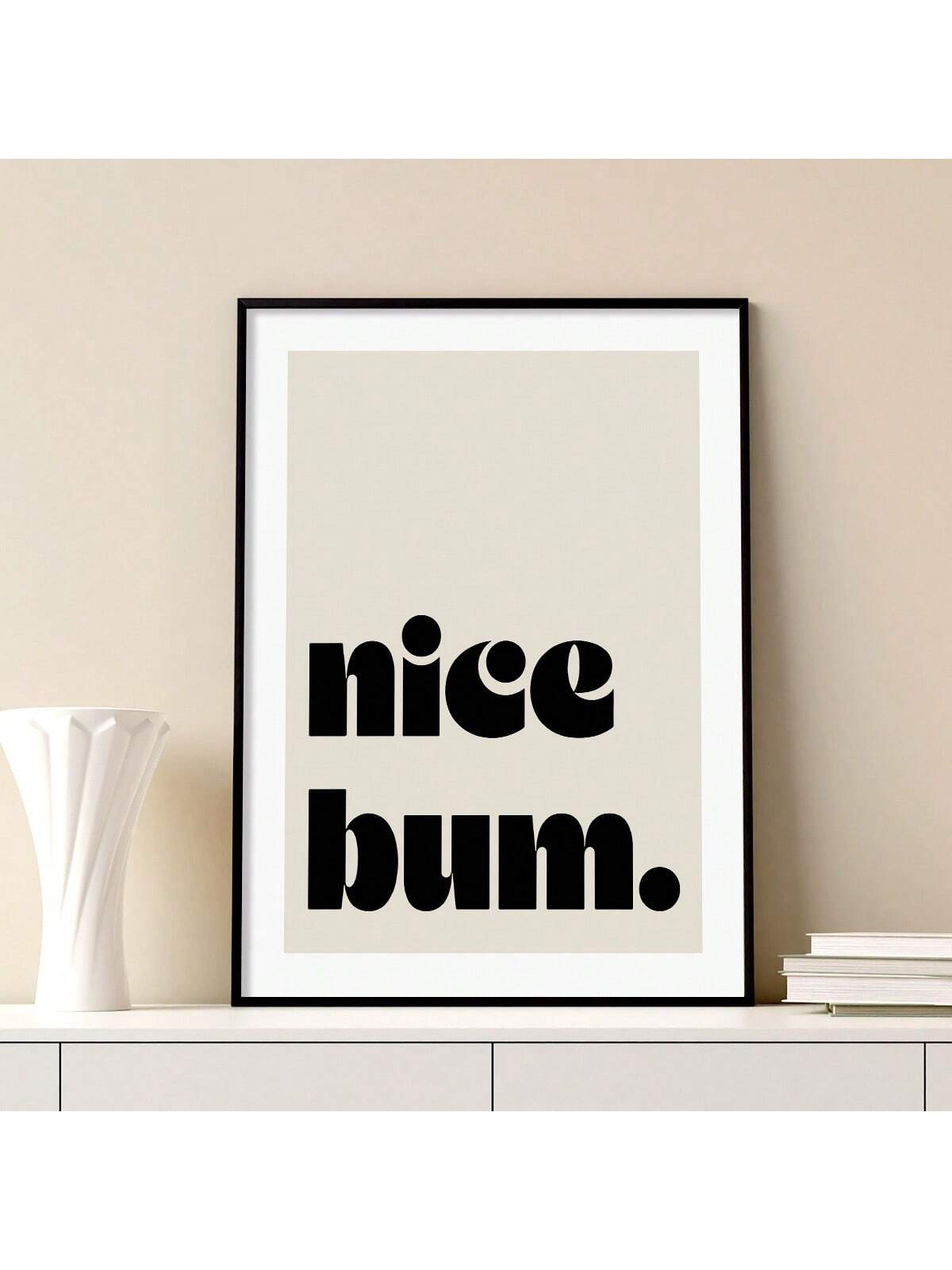 Elevate your interior design with our Chic 'Nice Bum' Canvas Poster. Perfect for adding a trendy touch to your bedroom, living room, or sofa backdrop. Use it to create a stylish bedside decoration or as part of your overall home decor. This high-quality print comes with no frame, providing a clean and modern look.