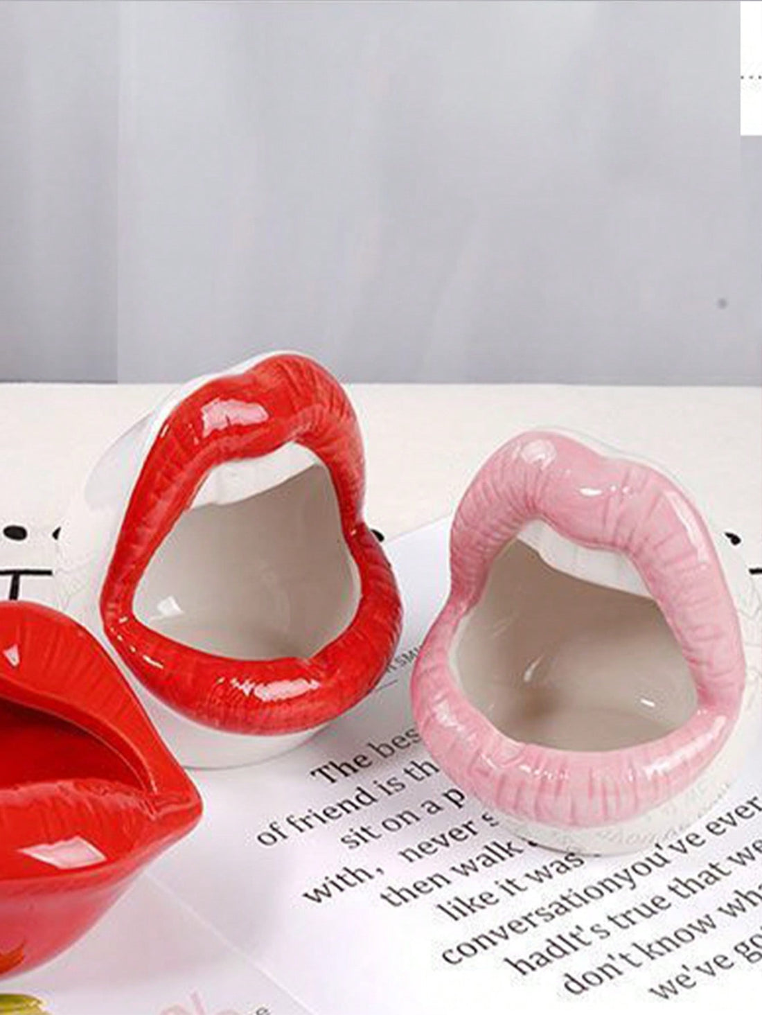 Introducing the Chic Red Lips Planter - the perfect combination of fun and functionality! Crafted with creative storage in mind, this planter is perfect for adding a pop of color to any room while keeping your space organized. Expertly designed for home and office use, make a statement with the Chic Red Lips Planter.