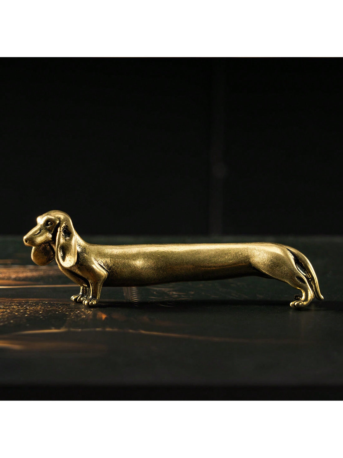Add a touch of timeless charm to your desk with our Classic Dachshund Desk Ornament. Crafted with love for pet lovers, this ornament is the perfect decor piece to showcase your love for your furry friend. Made with quality materials, it's a must-have for any dachshund enthusiast.
