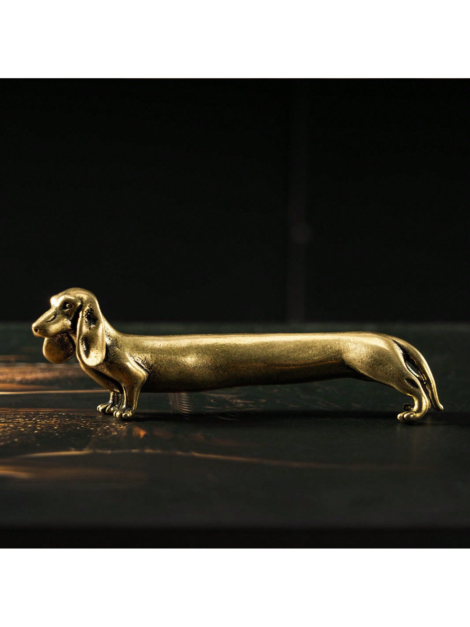 Add a touch of timeless charm to your desk with our Classic Dachshund Desk Ornament. Crafted with love for pet lovers, this ornament is the perfect decor piece to showcase your love for your furry friend. Made with quality materials, it's a must-have for any dachshund enthusiast.
