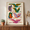 Crane wall art with colorful flying birds in teal green pink orange blue and cream