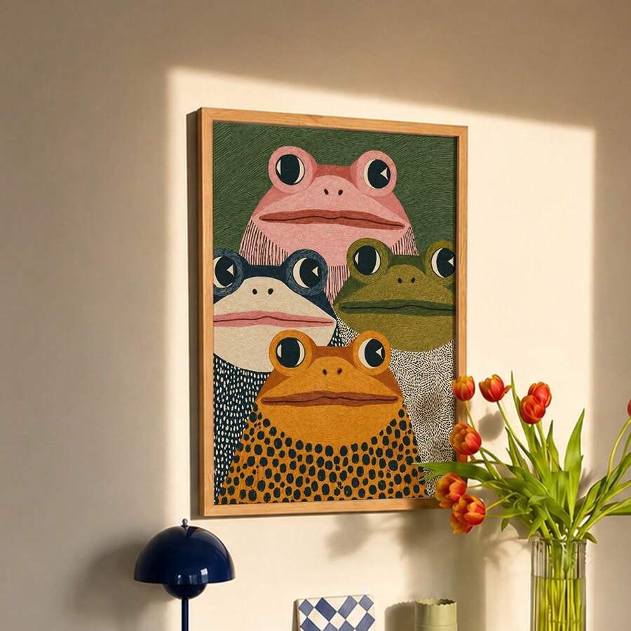 Four folk-art frogs with large dark eyes against a textured green canvas background